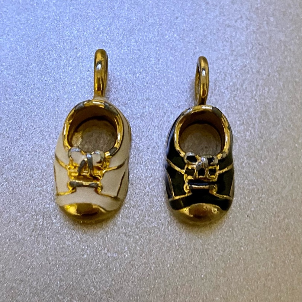 Two adorable enamel and gold tone baby shoes